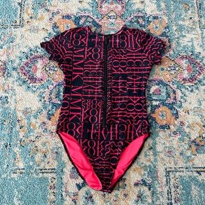 Women’s full coverage swimsuit with zipper.